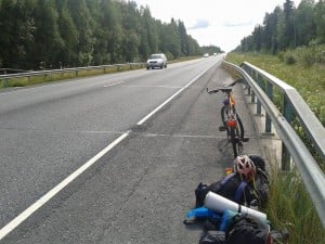This is me fixing my bicycle in the middle of the road.