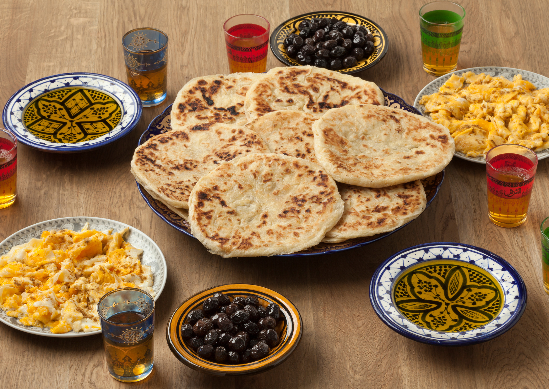 Traditional Breakfast in Morocco - Moroccan bread like Msemman, blacn olives and tea